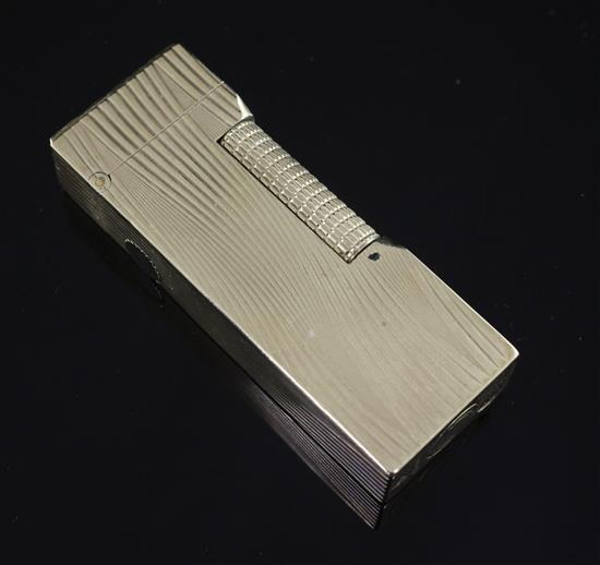 A 1960s 9ct gold Dunhill lighter, approx. 2.5in.
